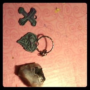 Keychain, necklace peace, and a rock